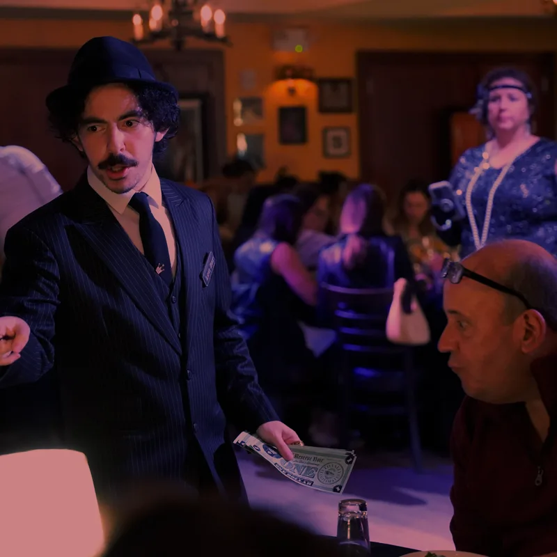 A detective questioning a guest at a Tulsa show